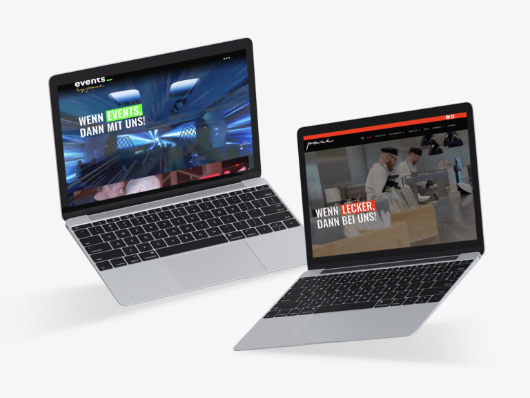 Zwei geöffnete Laptops zeigen verschiedene Websites an. Der linke Bildschirm zeigt eine Website zum Thema Veranstaltungen mit lila-blauer Beleuchtung, der rechte Bildschirm zeigt eine Website zum Thema Essen, auf der Köche arbeiten. Beide haben fettgedruckten deutschen Text auf den Bildschirmen.