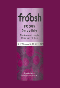 A purple Froosh smoothie in a can labeled “FOCUS” contains black currant, apple, strawberry, and açai. The can notes that the smoothie is enriched with additional vitamins to strengthen the immune system and contains no added sugar.